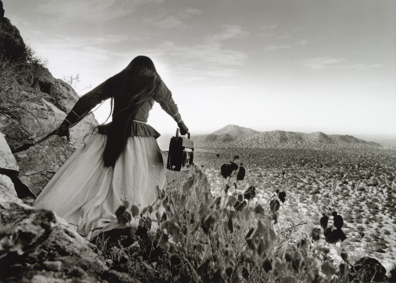 Graciela Iturbide (Mexican, b. 1942). Mujer &Aacute;ngel (Angel Woman), Sonora Desert, 1980. Gelatin silver print, 16 x 22 3/8 in.