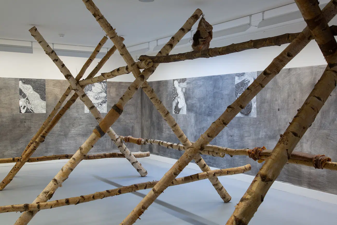 Tom Hallet, Snowy View - 41.296111 N 105.515000 W, 2023, birch wood, metal, latex, human-animal hair, rope, flowers, 250 &times; 200 &times; 600 cm. 