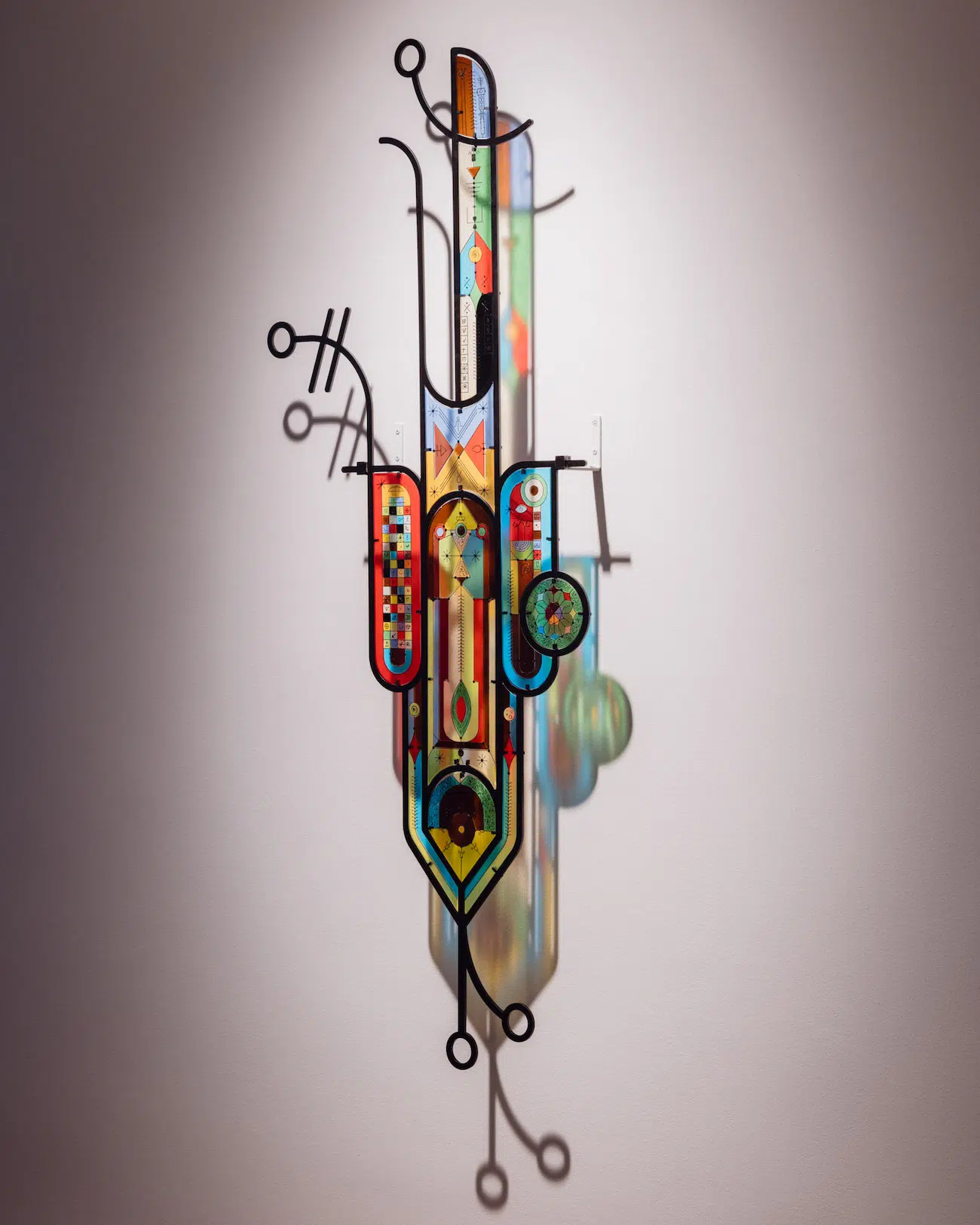 Wall-mounted sculpture, Aliaskar Abarkas, 2025, fused glass and iron framing, Scuola Piccola Zattere, Venice. (Photo: Matteo De Mayda)