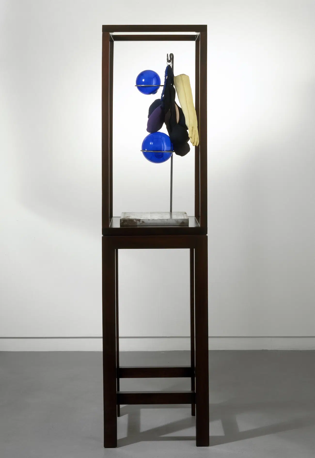 Louise Bourgeois, Untitled, 1998 , Fabric, steel and glass, 78.1 x 30.5 x 30.5 cm, Wood and glass vitrine: 182.8 x 45.7 x 45.7 cm