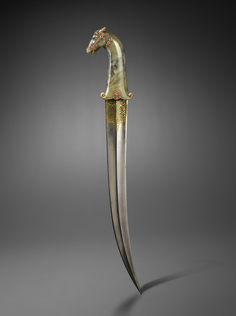 Dagger with horse head, ca. 1700. Mughal India. Jade, rubies, emeralds, and kundan gold; damascus steel inlayed with gold