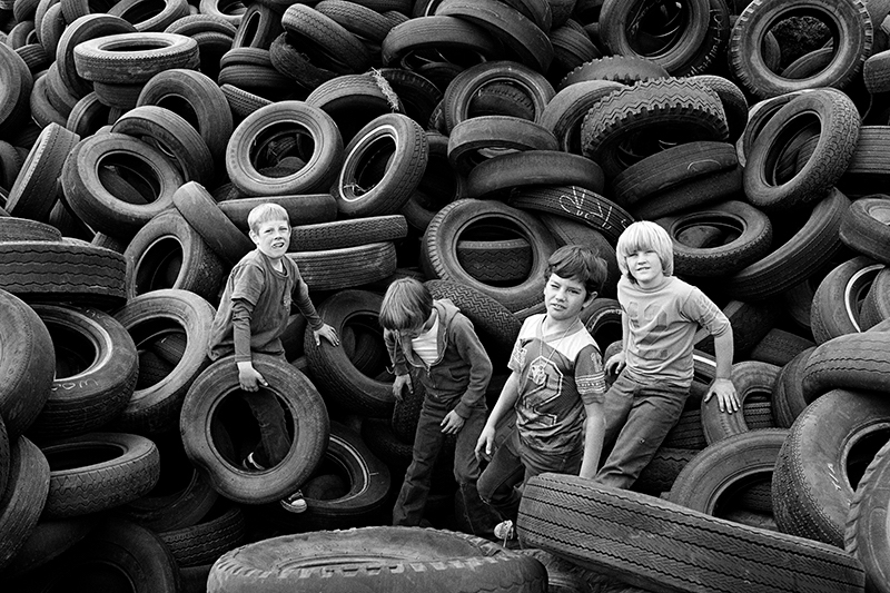 Mimi Plumb (American, born 1953), Boys and Tires, Sears Point, 1976, pigmented inkjet print