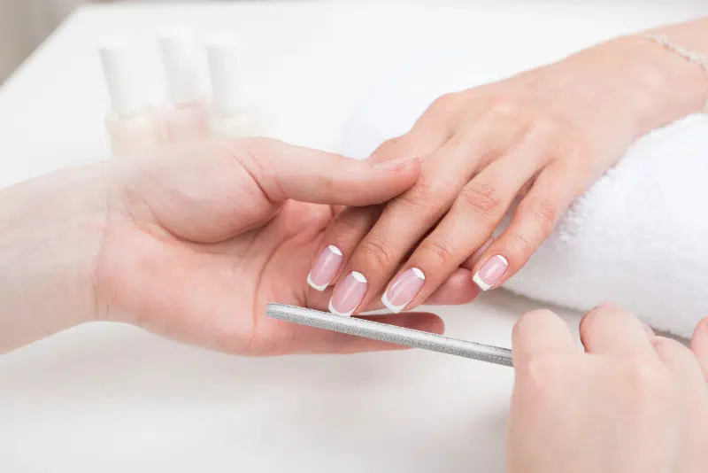 woman getting manicure