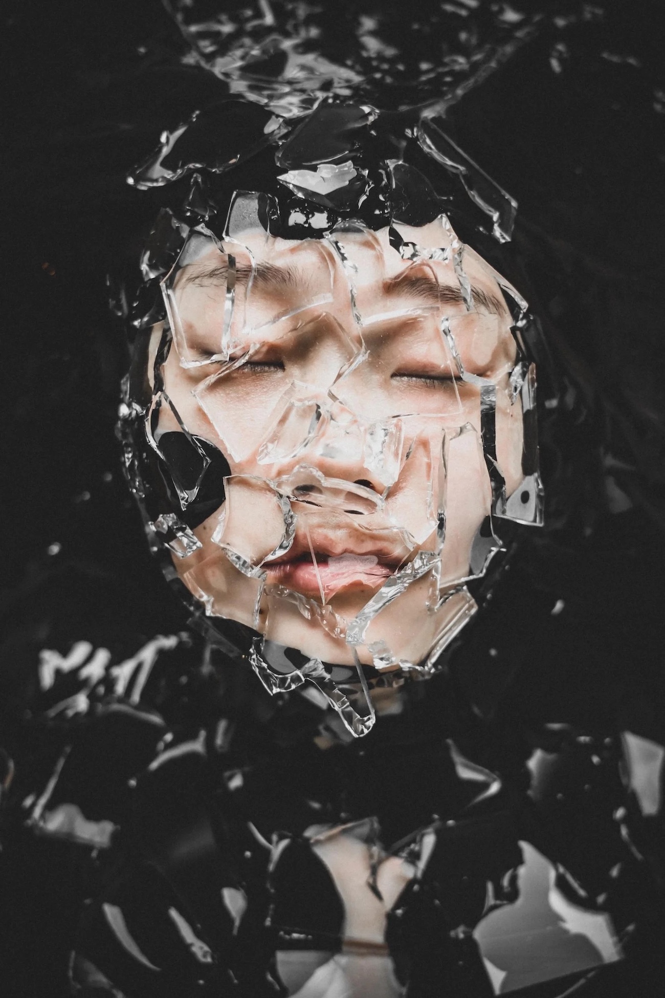 Photo of woman's face breaking through ice. 