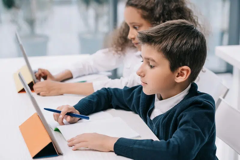 Photo of child studying on ipad.