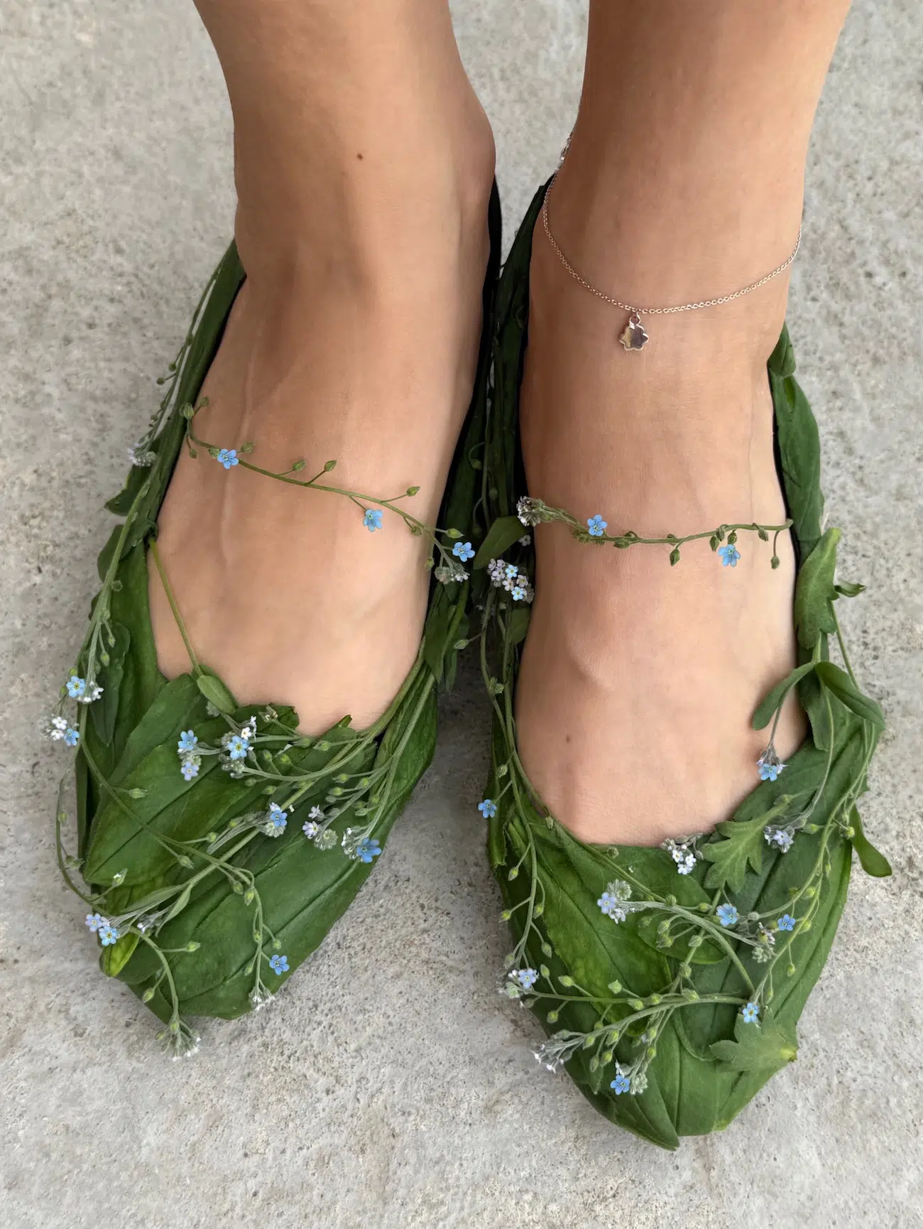 Green shoes made from flowers. 