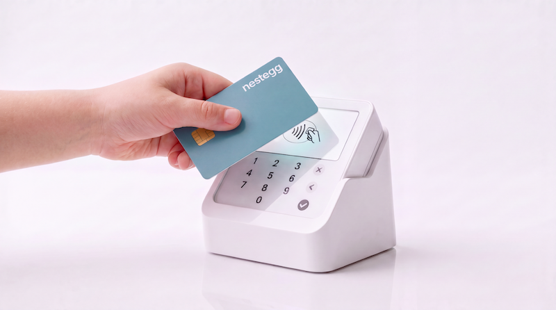 Photo of debit card being used to purchase something.