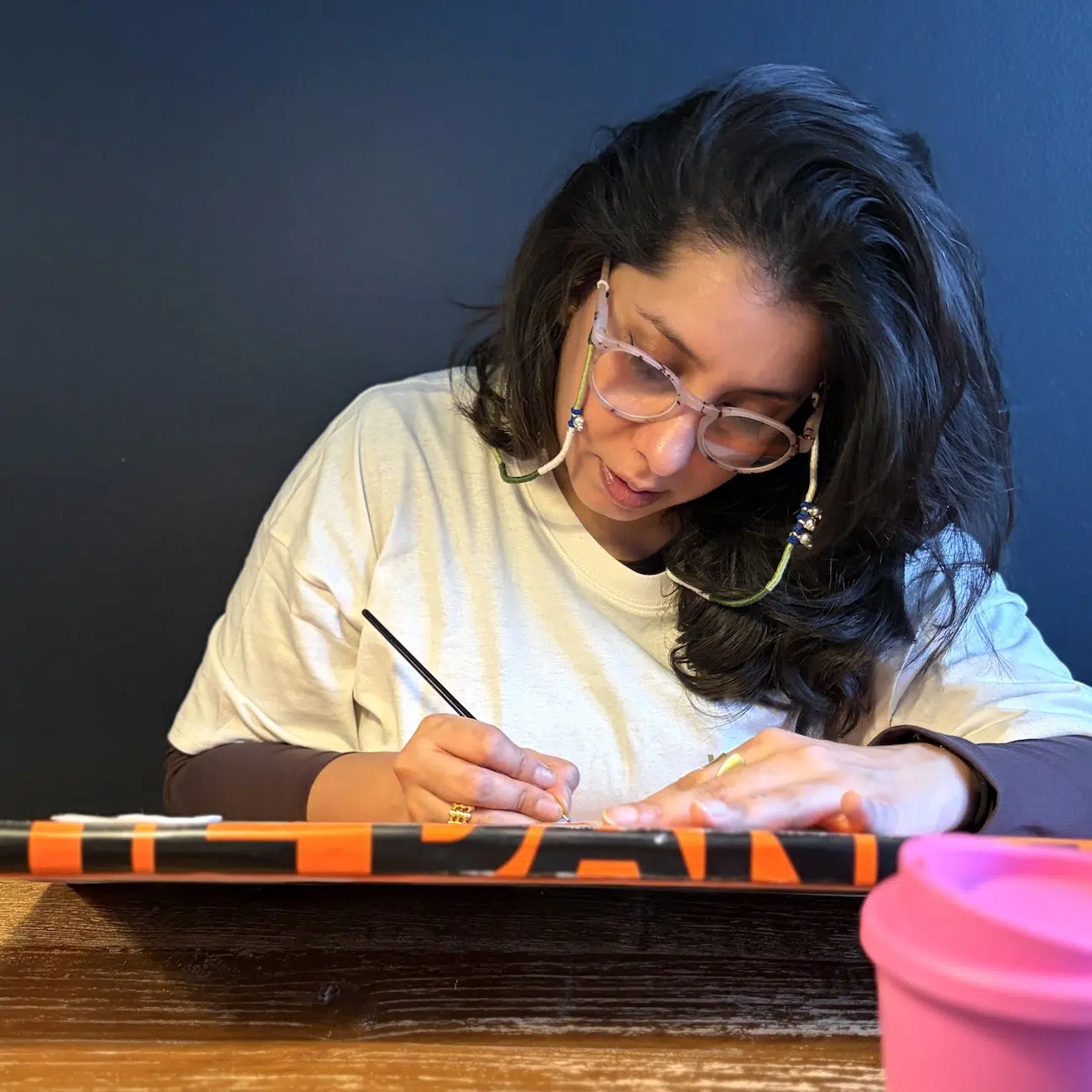 Photo of artist painting. 