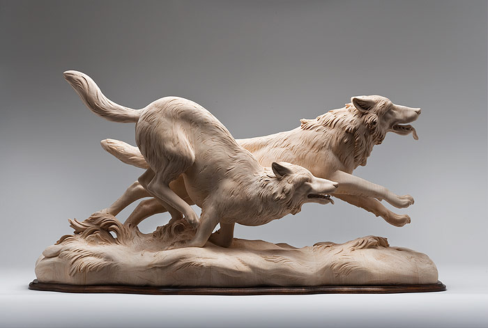 Large carved wooden store animals