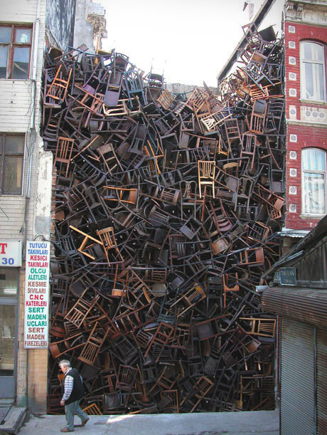 1550 Chairs Stacked Between Buildings