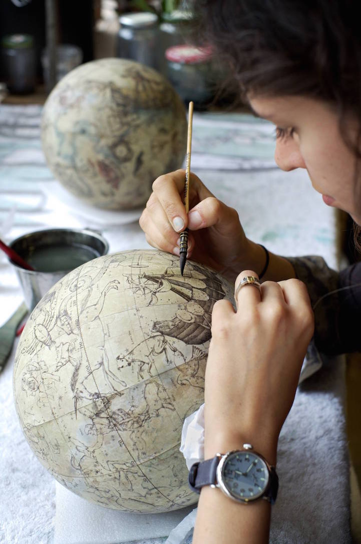 Woman Handmaking a Globe