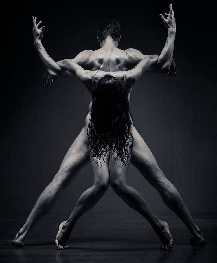 Portrait Of Dancers Dramatically Twisted Together
