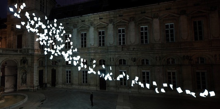 Illuminated Paper Blowing In The Wind