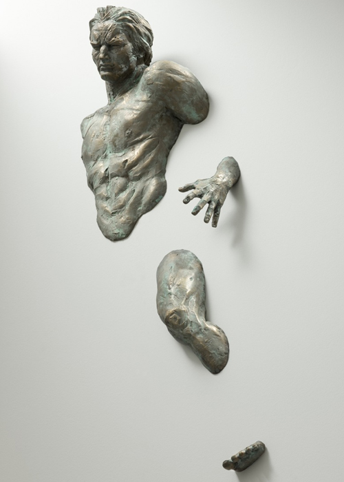 Athletic Bronze Sculptures Emerge from Walls